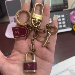 Louis Vuitton Burgundy and Gold Keychain